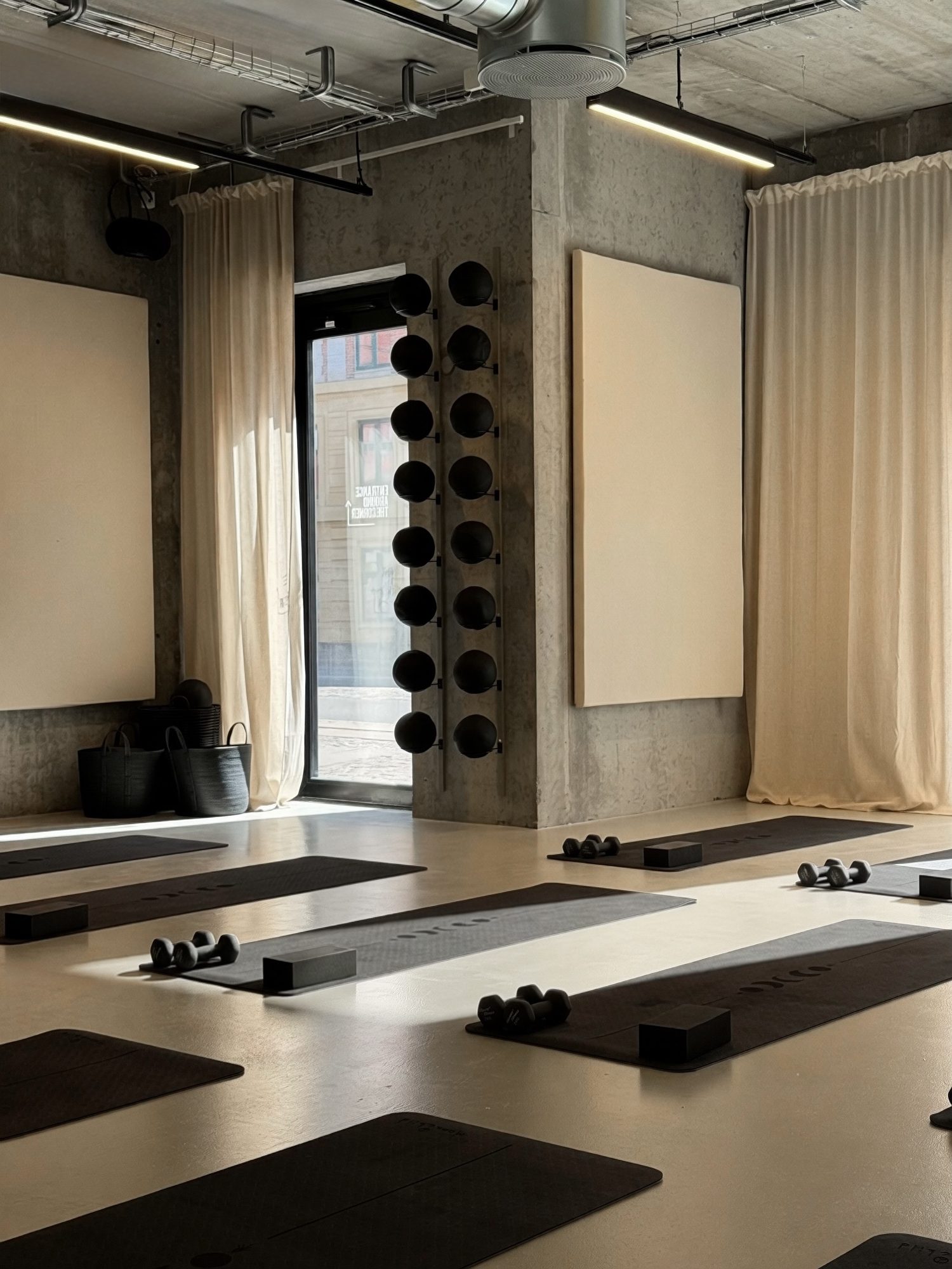 Mats, dumbbells and blocks set up for a Mat Moves Sculpt class.