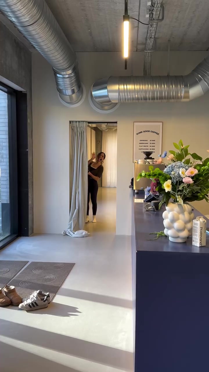 Some Good Moves welcome area with coffee counter, flowers and studio entrance.