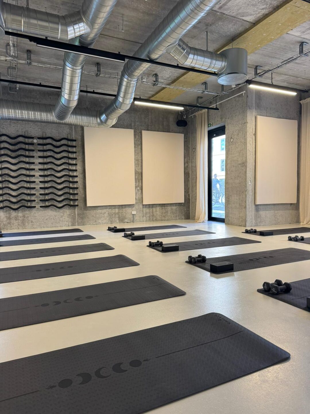 The mat and sculpt room at Some Good Moves with mats laid out ready for class
